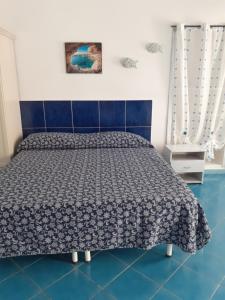 A bed or beds in a room at Da Lucia - Alloggio turistico Santa Maria