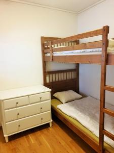 a bedroom with two bunk beds and a dresser at Mountain view 1 in Håra +18 photos