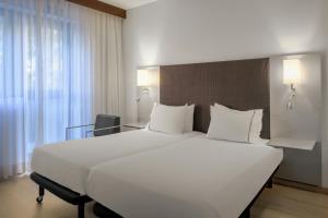 Postel nebo postele na pokoji v ubytování AC Hotel by Marriott Pisa