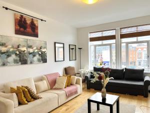 a living room with a couch and a table at Cosy Flat at Temple Bar Dublin in Dublin