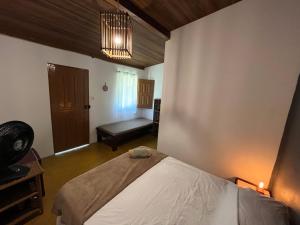 Postel nebo postele na pokoji v ubytování Caju com Mel