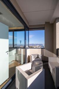 a living room with a view of the city at Bianca Apartments in Verona
