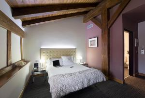 Postel nebo postele na pokoji v ubytování Hotel Dolarea