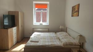 Una cama o camas en una habitación de Hotýlek.eu