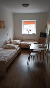 Una cama o camas en una habitación de Hotýlek.eu