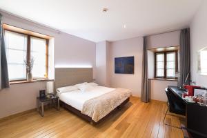 Postel nebo postele na pokoji v ubytování Hotel Dolarea