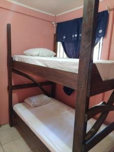 Ένα ή περισσότερα κρεβάτια σε δωμάτιο στο Monkey Beach House