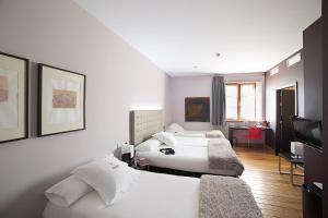 Postel nebo postele na pokoji v ubytování Hotel Dolarea