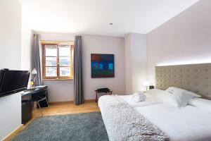 Postel nebo postele na pokoji v ubytování Hotel Dolarea
