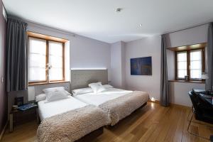 Postel nebo postele na pokoji v ubytování Hotel Dolarea