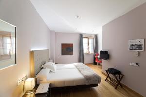 Postel nebo postele na pokoji v ubytování Hotel Dolarea