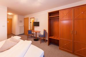 Postel nebo postele na pokoji v ubytování Hotel Tannerhof