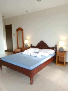 Katil atau katil-katil dalam bilik di SanJuan Rest Haus w Beach Access