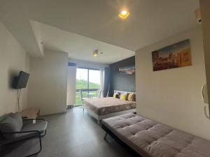 Postel nebo postele na pokoji v ubytování 豪华公寓Unixx景观房22
