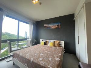 Postel nebo postele na pokoji v ubytování 豪华公寓Unixx景观房22 + 31 fotografií