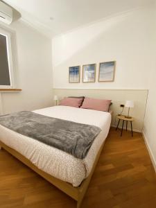 Postel nebo postele na pokoji v ubytování LovingRome Colosseum