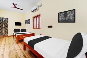 Afbeelding uit fotogalerij van Hotel O UDHAYA LODGE in Kuttālam +22 foto's