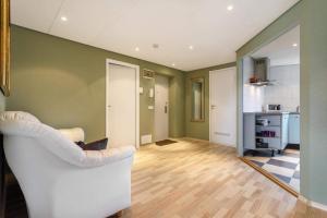 a living room with a couch and a mirror at Lubja Saun in Pärnu