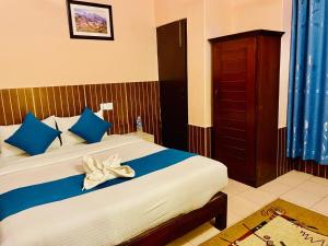 Łóżko lub łóżka w pokoju w obiekcie Hotel White Yak