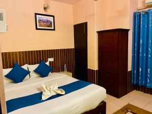 Łóżko lub łóżka w pokoju w obiekcie Hotel White Yak