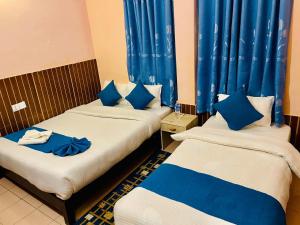 Łóżko lub łóżka w pokoju w obiekcie Hotel White Yak
