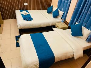 Łóżko lub łóżka w pokoju w obiekcie Hotel White Yak