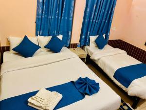 Łóżko lub łóżka w pokoju w obiekcie Hotel White Yak