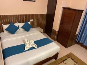 Łóżko lub łóżka w pokoju w obiekcie Hotel White Yak