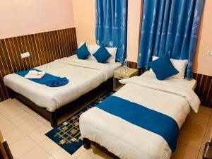 Łóżko lub łóżka w pokoju w obiekcie Hotel White Yak