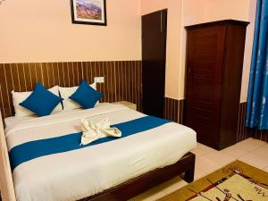 Łóżko lub łóżka w pokoju w obiekcie Hotel White Yak