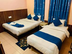 Łóżko lub łóżka w pokoju w obiekcie Hotel White Yak