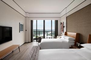 Postel nebo postele na pokoji v ubytování Sheraton Mianyang