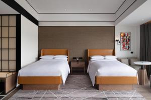 Postel nebo postele na pokoji v ubytování Sheraton Mianyang