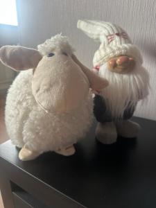 two stuffed animals sitting on top of a table at Mare et Ventus in Ventspils