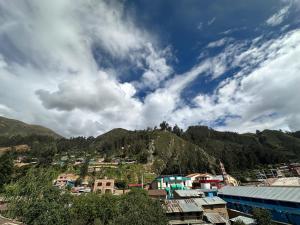 a view of a town with a mountain at Sol de América in La Unión