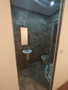 a bathroom with a sink and a toilet at New Marsalforn Serenity Stay & Near Sea Apartment in Marsalforn +7 photos