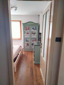 a bedroom with a bed and a dresser in it at Casa Vacanze Tel 121 in Pieve Tesino