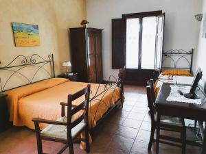 Ένα ή περισσότερα κρεβάτια σε δωμάτιο στο Agriturismo Borgo Levante