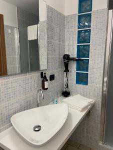 a bathroom with a sink and a mirror at Agriturismo Bordigaie in Bruscoli +30 photos
