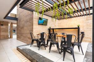 TV a/nebo společenská místnost v ubytování Hotel 28 Cancun