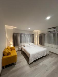 Postel nebo postele na pokoji v ubytování Hotel Nanon Sathorn