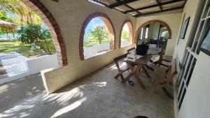 an outside view of a room with a table and windows at Casita d Playa 1 in La Esmeralda