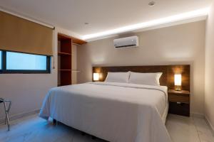 Postel nebo postele na pokoji v ubytování Hotel 28 Cancun