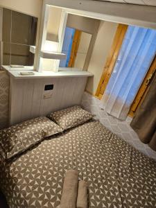 A bed or beds in a room at Ca' Angiolo ai Frari