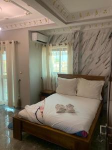 Postel nebo postele na pokoji v ubytování DEUDJUI HOTEL