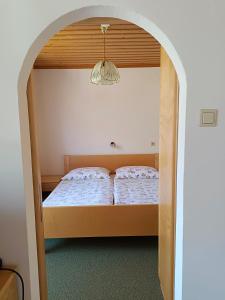 Postel nebo postele na pokoji v ubytování Ferienwohnungen Mörtl