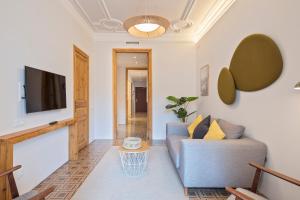 Televízia a/alebo spoločenská miestnosť v ubytovaní Central Apartments Barcelona