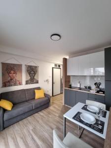 a living room with a couch and a table at Lemon Bliss Studio in Skopje