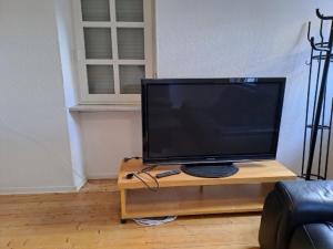 a television sitting on a table in a living room at Casa Danieli 1 in Bechtolsheim