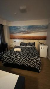 Postel nebo postele na pokoji v ubytování FLAT NO CORAÇÃO De ALPHAVILLE